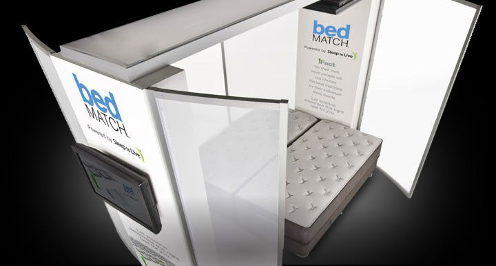 BedMatch system booth, used for customizing mattress recommendations, shown with a mattress inside.