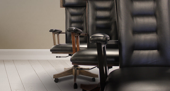 Row of black leather office chairs